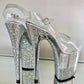 Transparent glitter platform heels with transparent glitter straps. Silver glitter on the arches and inside of heels. White soles.