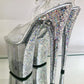 Transparent glitter platform heels with transparent glitter straps. Silver glitter on the arches and inside of heels. White soles.