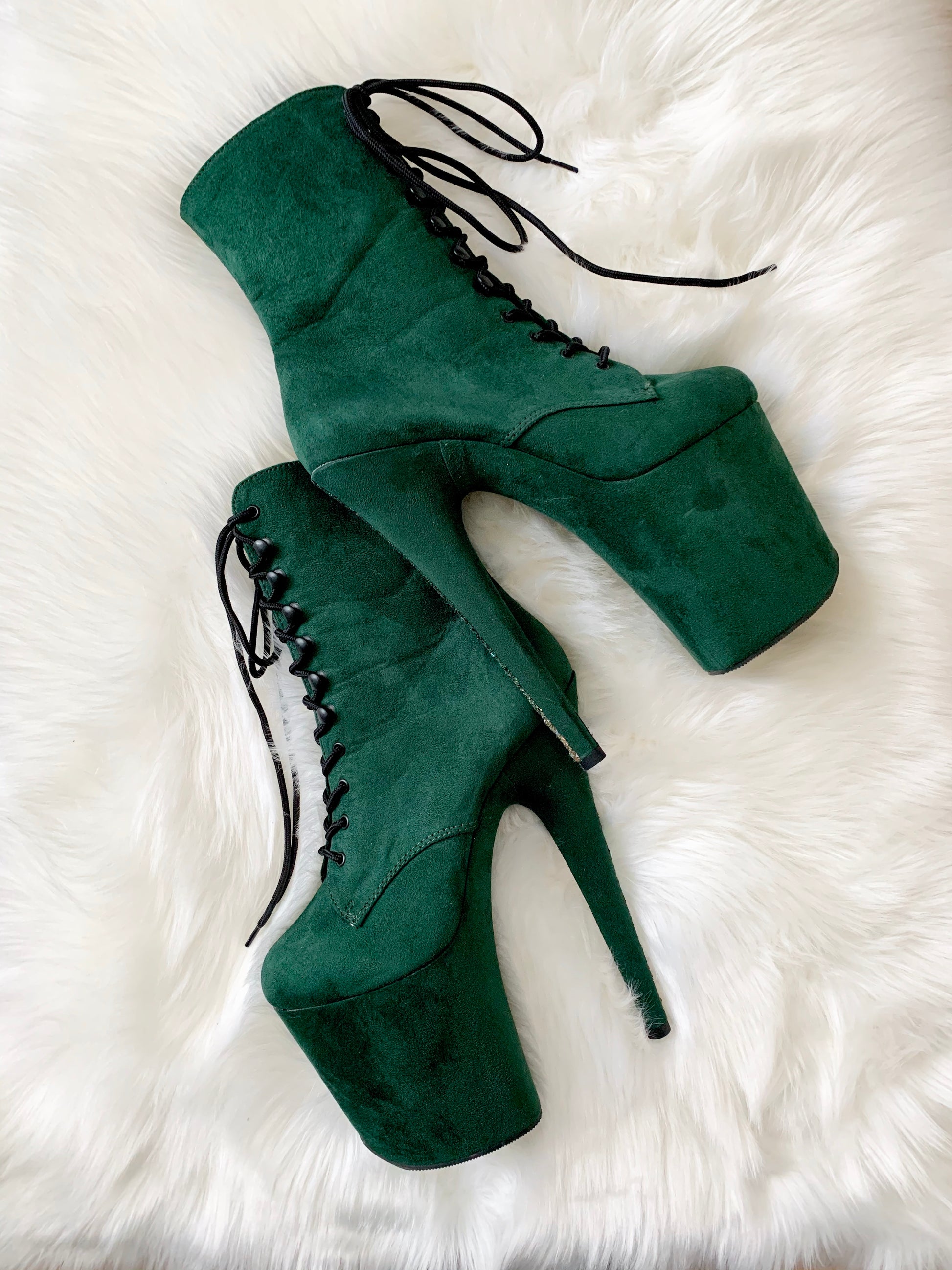 Dark green suede boots with a dark green glitter strip going down the back of both heels. Lace-up front, inside zipper. 