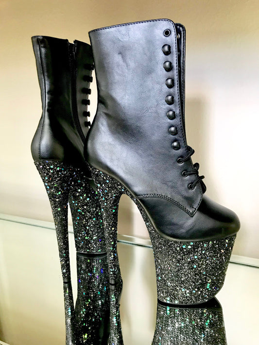 Black matte boots with black glitter on the platforms, arch, and heels.  Lace-up front, inside zipper.